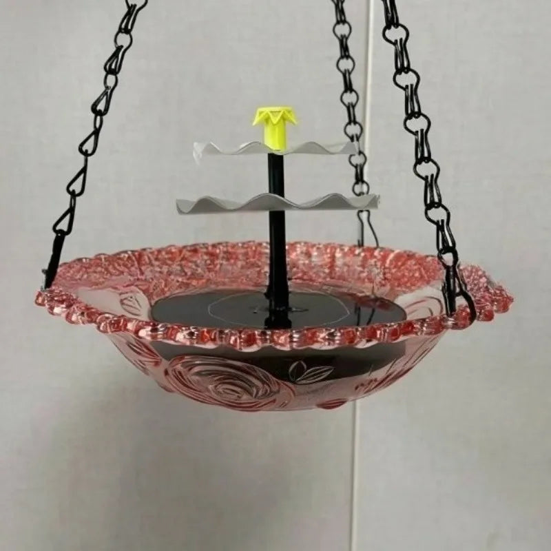 Hängende Außensolar-Vogelbad-Fontäne mit mehrstufigem Wasserfeature, pinker Schale und gelber Spitze.