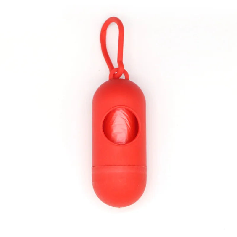 Red capsule-shaped dog poop bag dispenser with a carabiner clip.