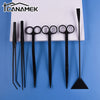 A set of black stainless steel aquarium plant trimming tools including various scissors and forceps.