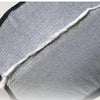 Close-up of a gray double-sided pet grooming glove for cats and dogs showing the textured fabric and stitching.