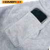A gray fabric garment with a pocket holding a black smartphone.