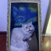A fluffy gray cat is resting on a decorative bed with an ornate frame and a blue, swirling background.