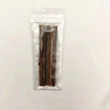 A clear plastic bag containing several dark brown natural herbal cat chew sticks.