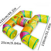 A yellow and green foldable cat play tunnel for indoor exercise, shown in a curved shape.