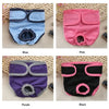 Four reusable dog diapers in blue, pink, purple, and black shown individually on a light background.