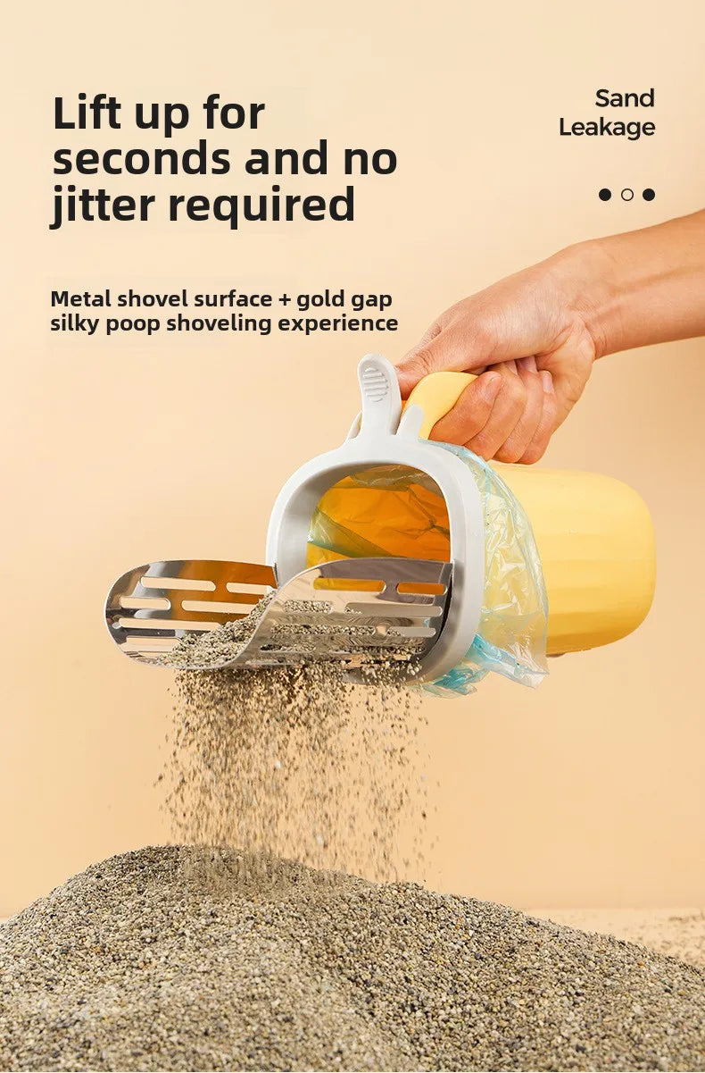 A hand is using a stainless steel cat litter shovel with a gold gap and a clear refill bag to lift dry litter from a pile.