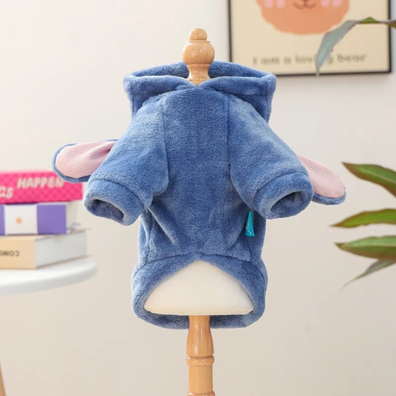 A blue flannel hoodie for a small dog displayed on a wooden mannequin.
