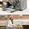 A woman is shown riding a bicycle with a carrier bag for a cat mounted on the front rack.