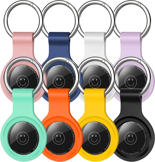 A set of silicone airtag protective covers with metal keychains in various colors including pink, blue, white, purple, orange