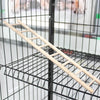 A wooden bird ladder with hooks is shown inside a black wire cage.