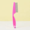 A pink one-button pet hair removal brush with a metal comb is shown against a light yellow background.