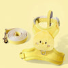 A yellow cute animal walking harness and leash set with a fluffy yellow chick charm.