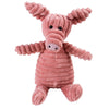 Juguete suave rosa en forma de cerdo o jabalí, usado como juguete masticable para limpieza dental.