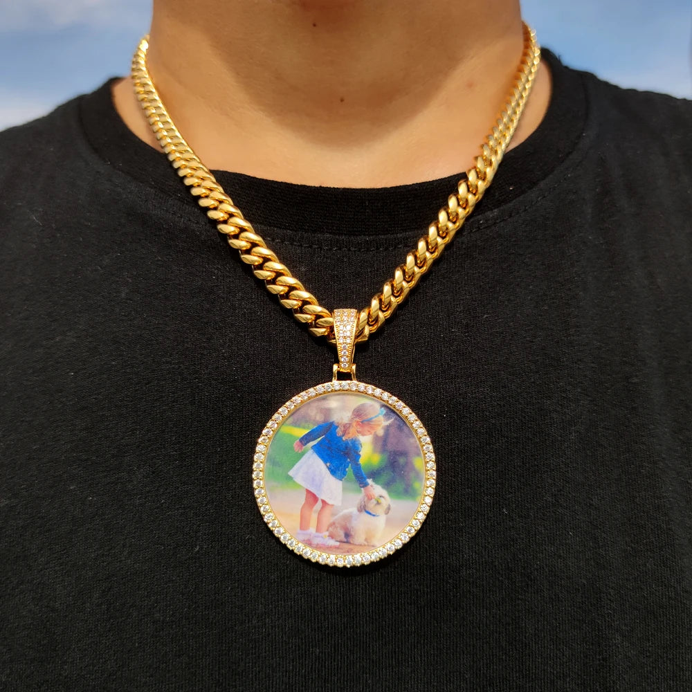 A gold chain necklace features a circular pendant depicting a child and a dog.