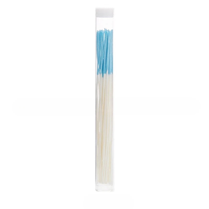A clear tube containing a set of blue and white disposable ear cleaning tools.