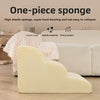 A light yellow, heart-shaped, one-piece sponge product is shown on a wooden surface.