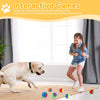 A young girl is playing with a dog and squeaky balls on the floor.