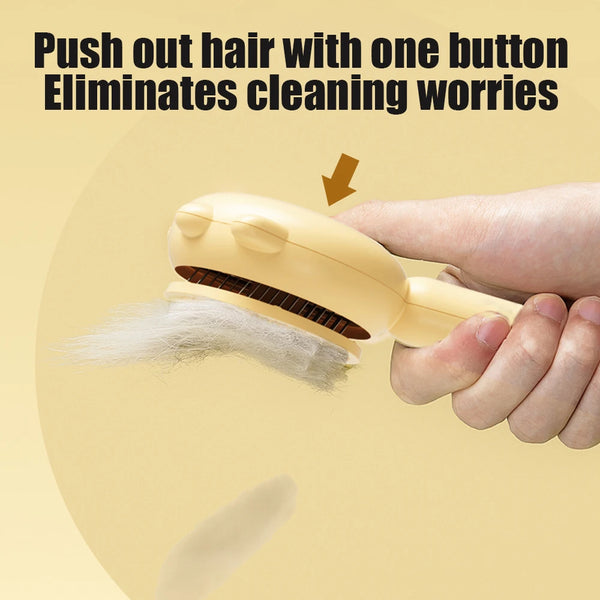 A hand is using a yellow pet hair removal brush to push out hair.