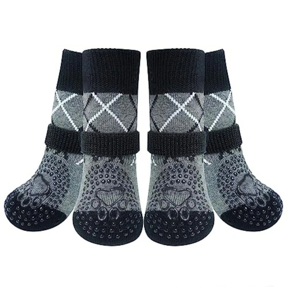 A pair of black knitted anti-slip dog socks with a patterned design.