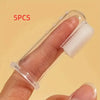 Five silicone pet toothbrushes are shown being held on a person's finger.