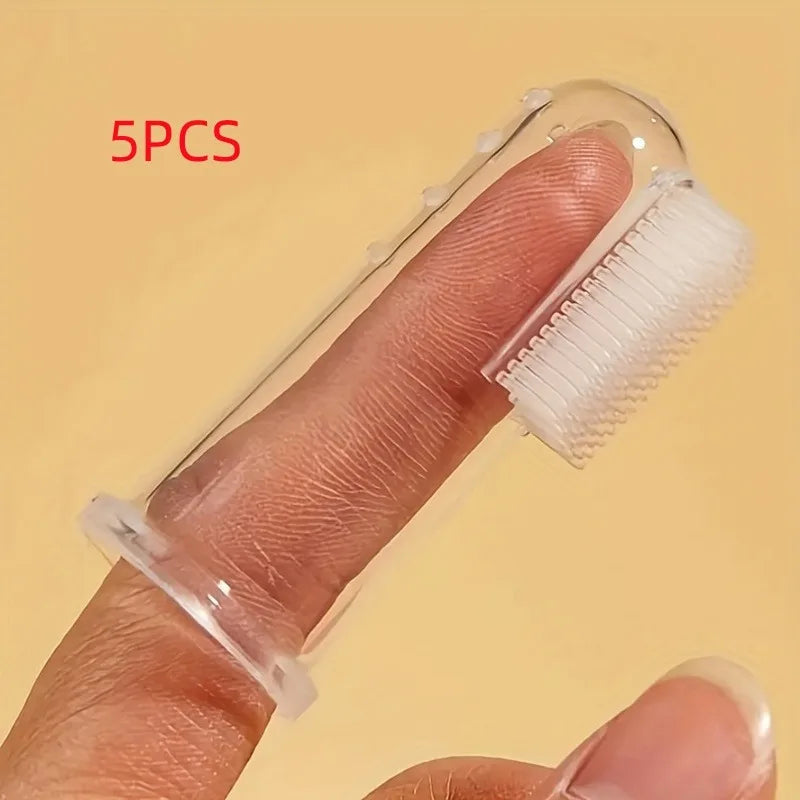Five silicone pet toothbrushes are shown being held on a person's finger.