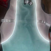 A light blue evaporative cooling dog vest with a reflective harness is displayed against a white background.