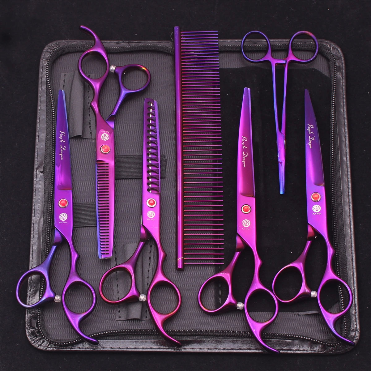 A set of professional stainless steel pet grooming scissors and brushes displayed in a black case.