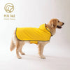 A golden retriever wearing a bright yellow all-weather dual-sided dog raincoat.