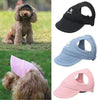 Colección de gorras deportivas para mascotas ajustables en colores negro, azul claro y rosa.