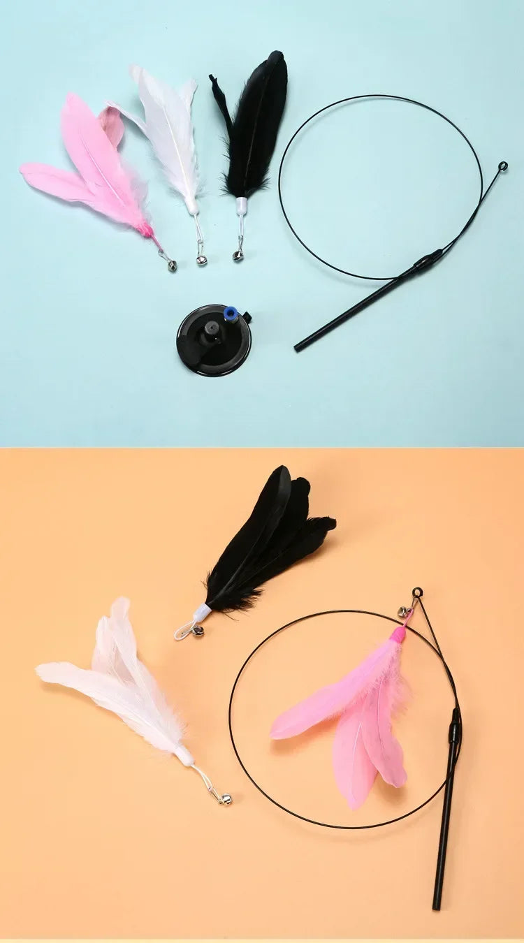 A black suction cup wand with a pink feather toy and a black handle on a light blue background.
