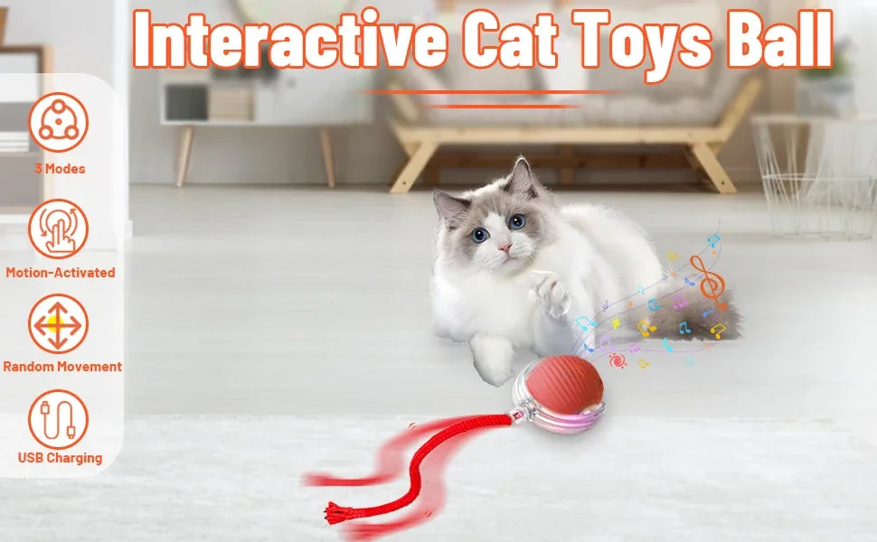 A white cat playing with an interactive ball toy that is red and features a USB charging cable.