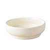 A white ceramic bowl for pets with a matching stand.