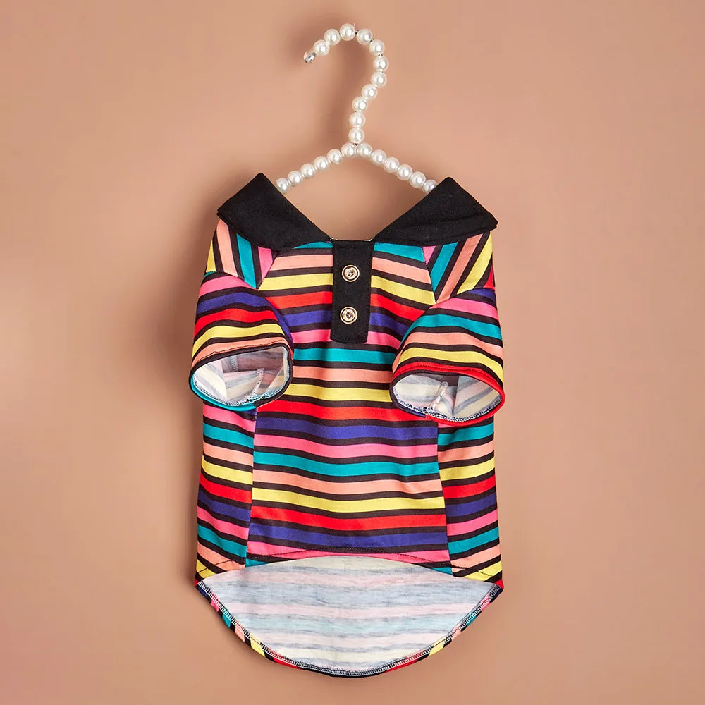 A colorful striped polo shirt for a small dog, featuring horizontal stripes in various bright colors.