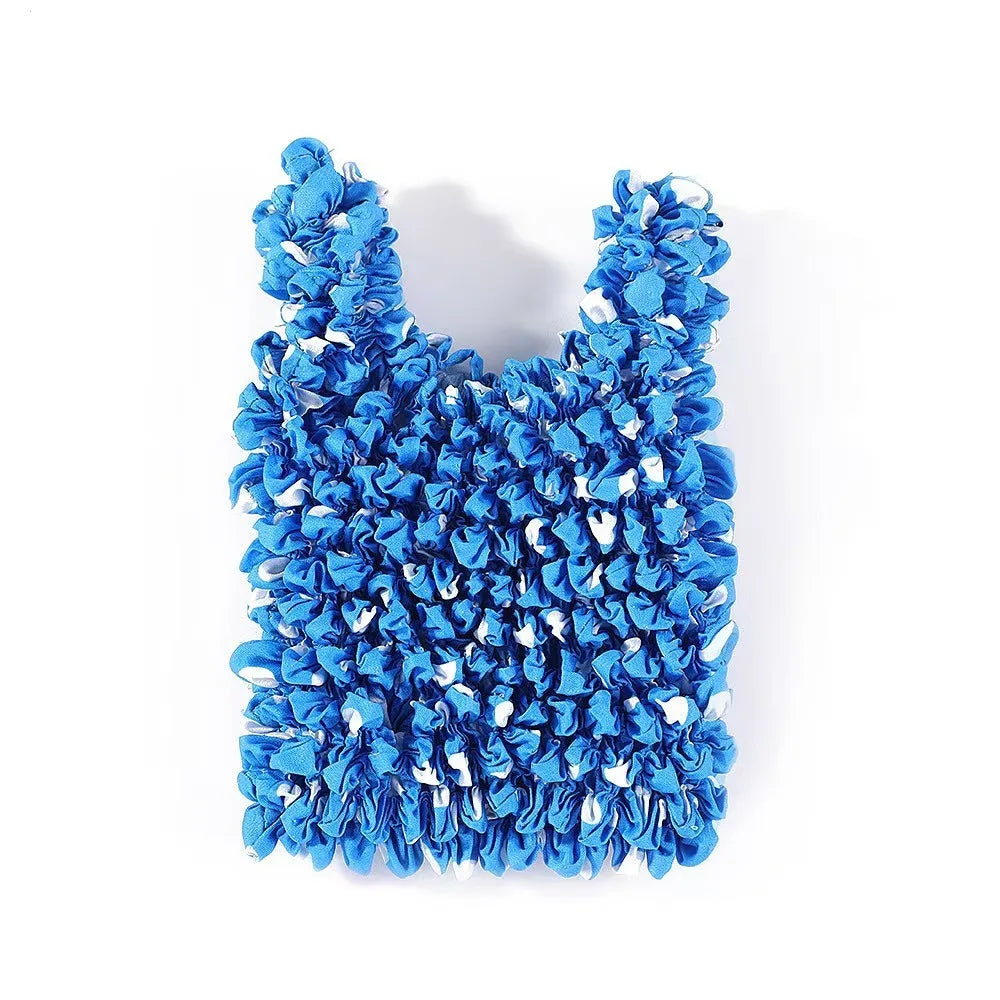 A close-up of a reusable foldable bubble shopping bag made of bright blue ruffled fabric.