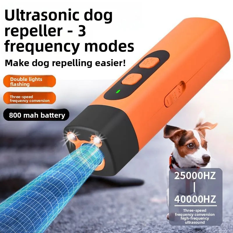 Orange ultrasonic dog repeller device with a blue tip demonstrating high-frequency ultrasound waves.