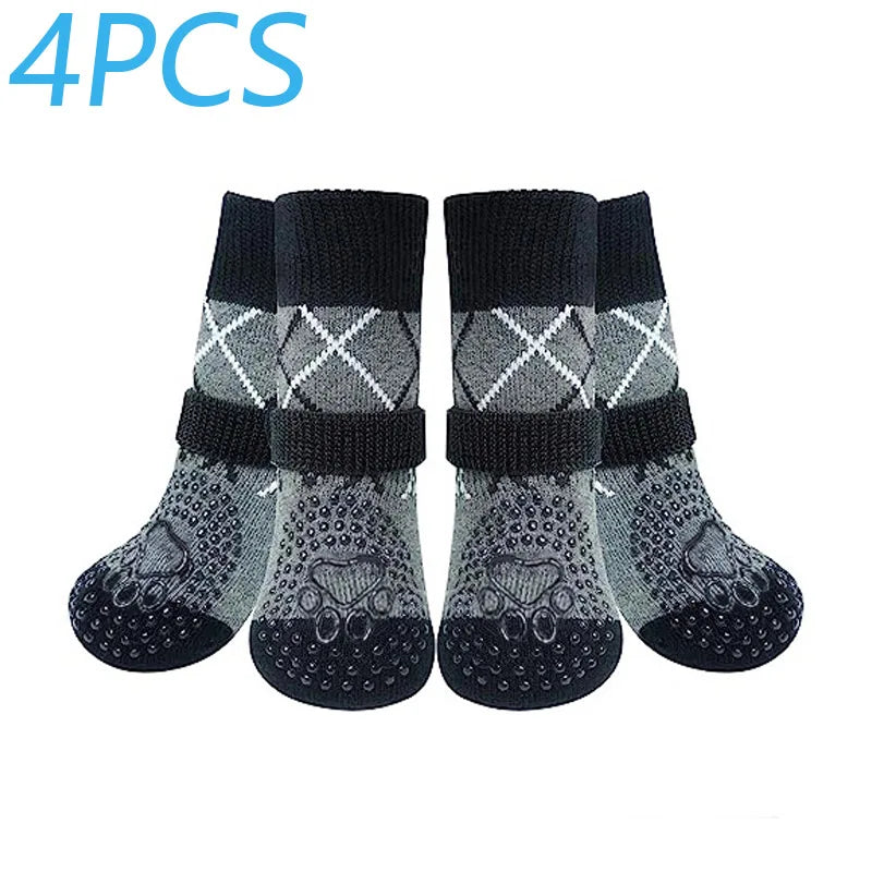 Four pairs of black and gray anti-slip dog traction socks displayed side by side.