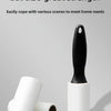 A black heavy-duty lint roller is shown next to two white rolls, demonstrating its strength for pet hair removal.