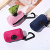Pink and dark blue portable mesh dog waste bag dispensers with black clasps shown on a white background.