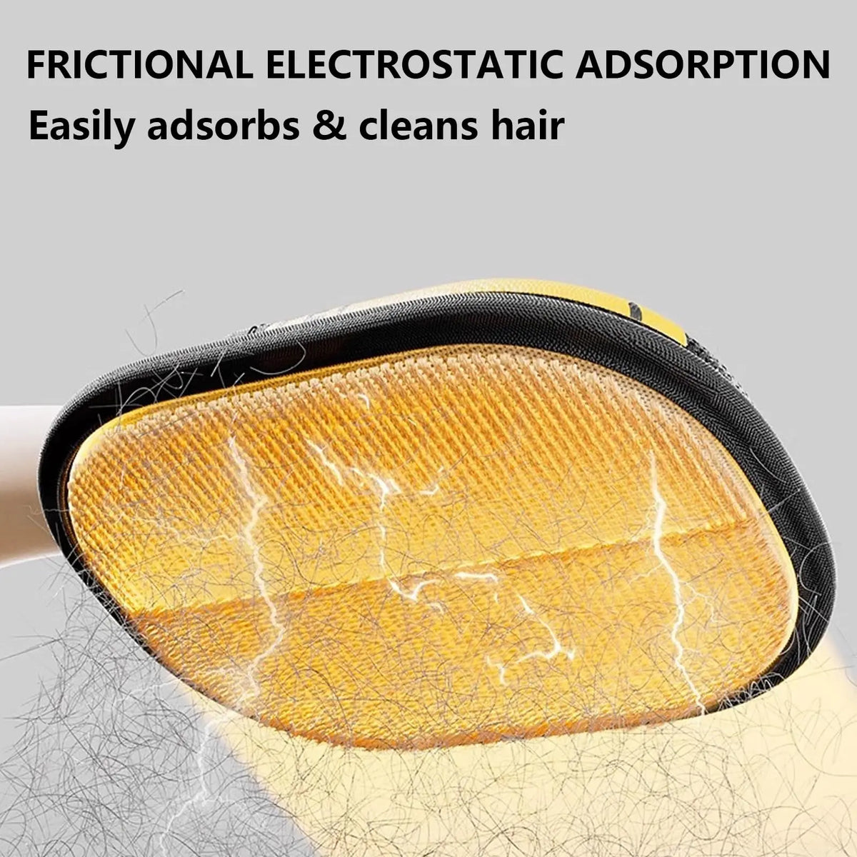 Close-up of a yellow silicone pad for a pet hair remover glove showing electrostatic adsorption fibers.