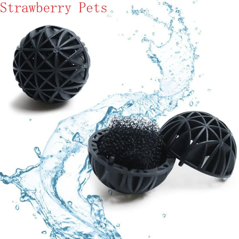 Black strawberry pets bio balls floating in water, showing a splash effect.
