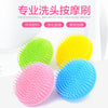 A set of three silicone shampoo and massage brushes in green, yellow, and blue are displayed on a white background.