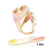 A pink and white adjustable dog harness with reflective straps is shown against a white background.