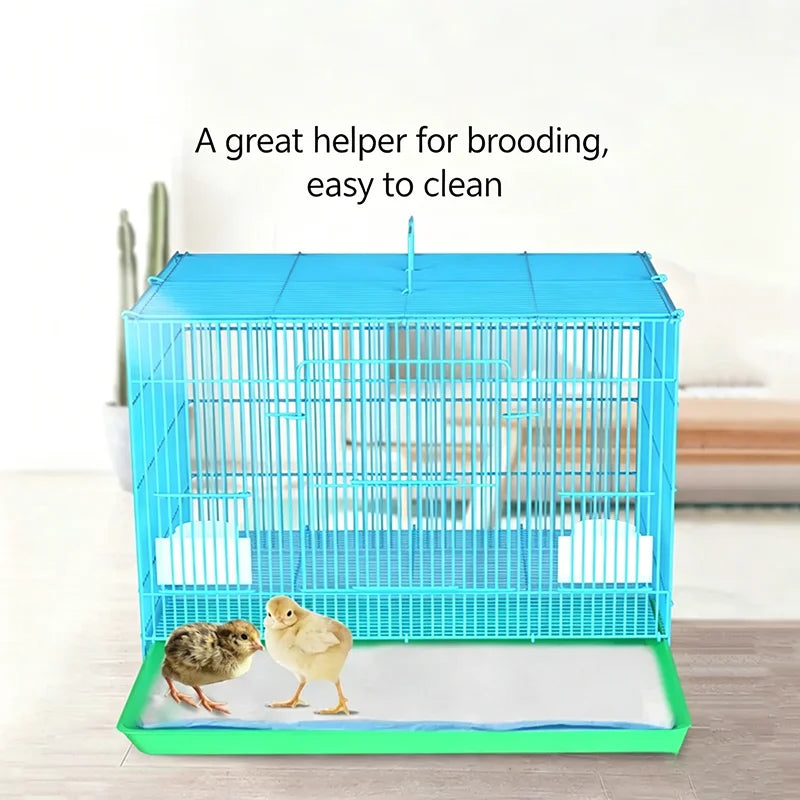A bright blue wire crate for a small pet with a white absorbent pad inside.