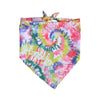 A colorful tie-dye dog accessories set featuring pink, green, yellow, and purple swirls.