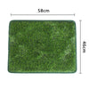 A rectangular green artificial grass mat measuring 58cm by 46cm for dog use.