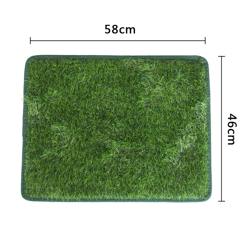 A rectangular green artificial grass mat measuring 58cm by 46cm for dog use.