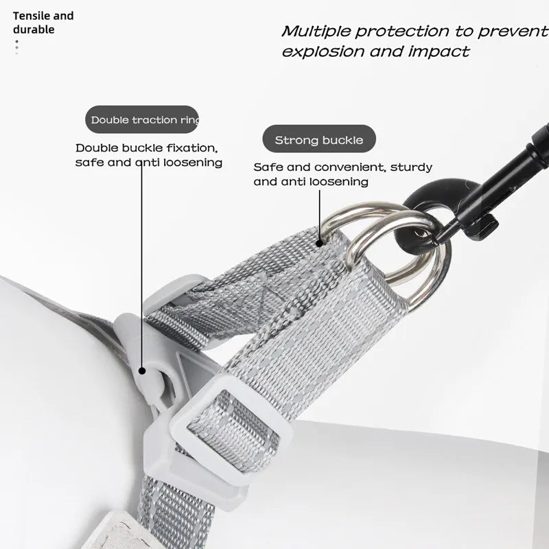 Close-up of an adjustable reflective mesh dog harness vest showing double traction rings and a strong buckle mechanism.