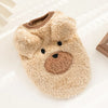 A fluffy, light beige fleece puffer vest shaped like a bear face for small pets.