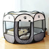 A folding octagonal pet cage for dogs with a mesh enclosure and soft bedding inside.