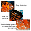 Orange fabric dress decorated with gold stamping pattern and a bow for Halloween